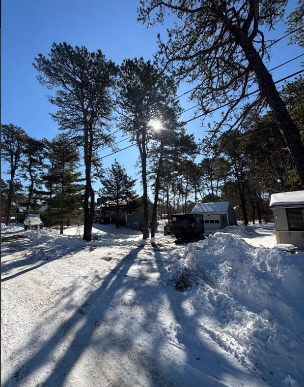 Winter dumpster rental in the snow in Harwich, MA